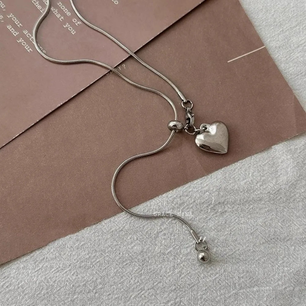 Collar largo de acero inoxidable con colgante de corazón, cadena ajustable para suéter, accesorios de joyería de moda para mujer 2025